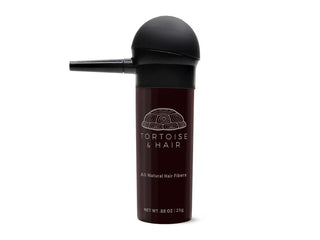 Tortoise and Hair Spray Applicator on a bottle of hair fibers